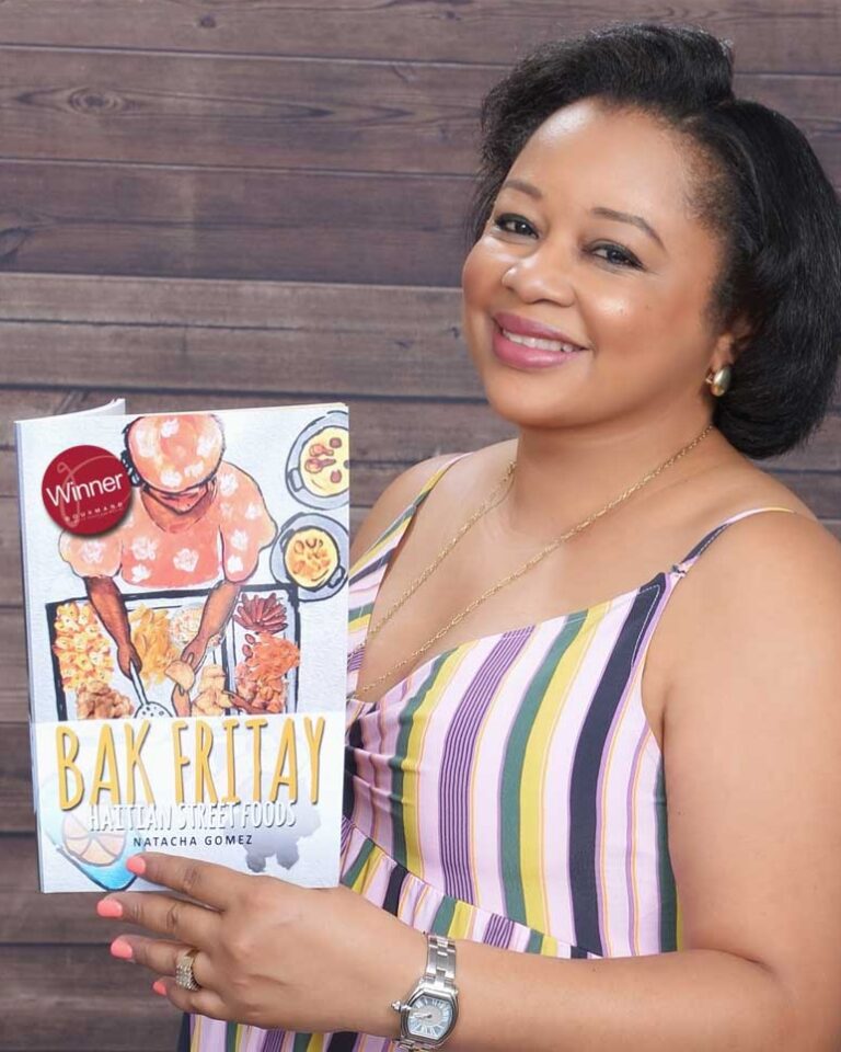 A woman holding up a book with the words " bak friday ".